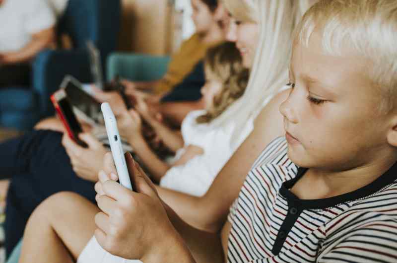 Phone Addicted Family Using Their Phones Couch